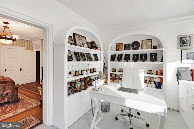 home office featuring light tile patterned floors, built in features, and crown molding