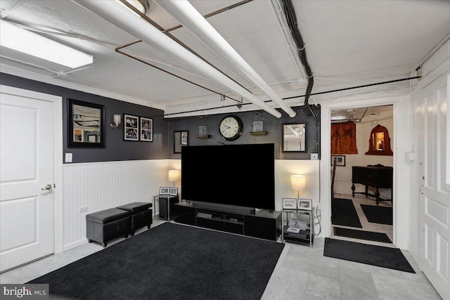 living room featuring wainscoting