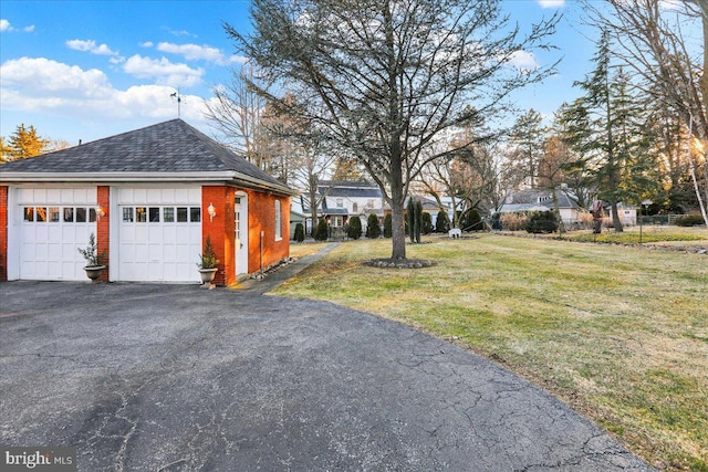 exterior space with an outbuilding and a garage