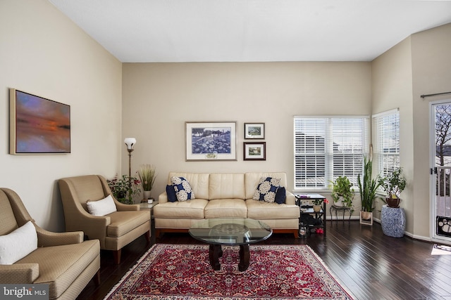 living room with dark wood finished floors and baseboards