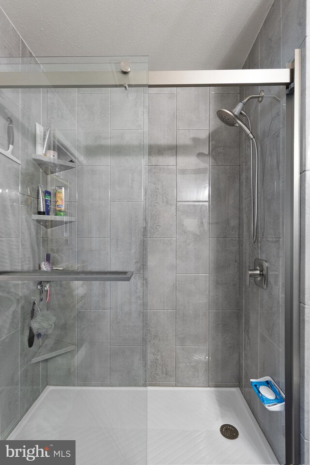 bathroom featuring a shower stall