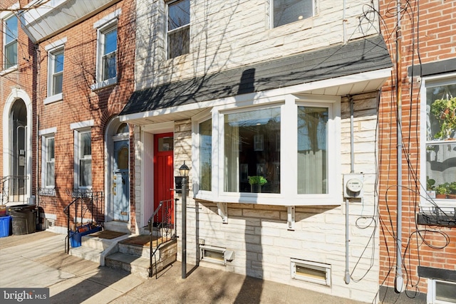 entrance to property with brick siding