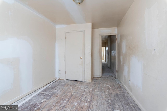 unfurnished bedroom featuring hardwood / wood-style floors