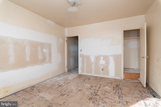 unfurnished bedroom featuring visible vents