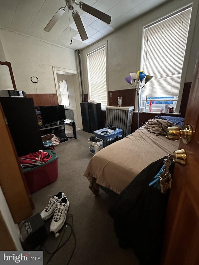 carpeted bedroom featuring a ceiling fan