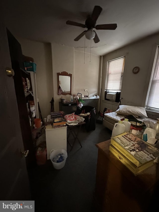 interior space featuring cooling unit and a ceiling fan