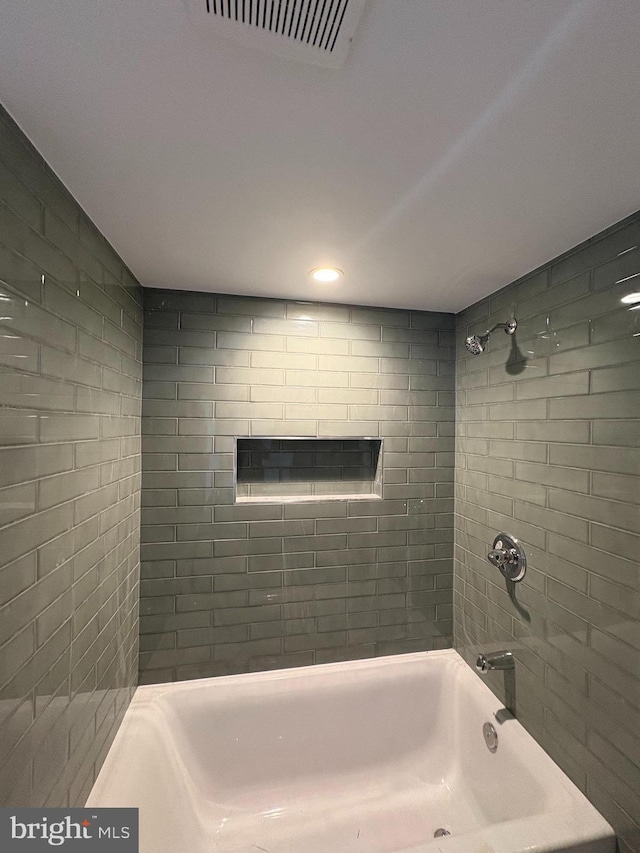 full bathroom with visible vents and washtub / shower combination