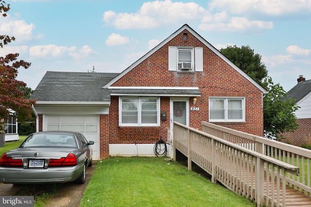 view of front of property featuring brick siding, a front yard, roof with shingles, cooling unit, and a garage