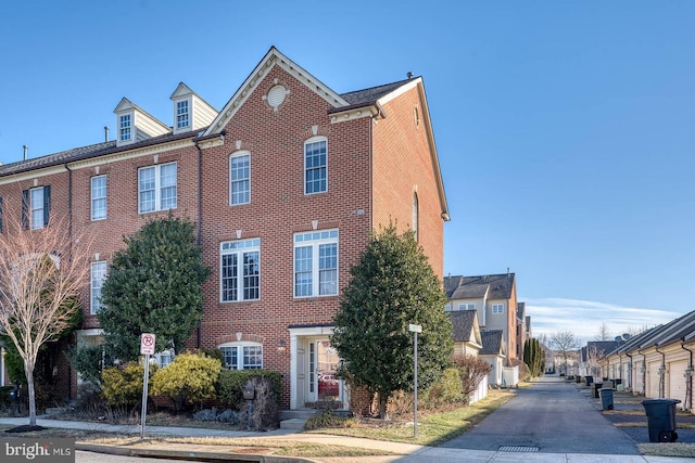 view of property exterior featuring brick siding