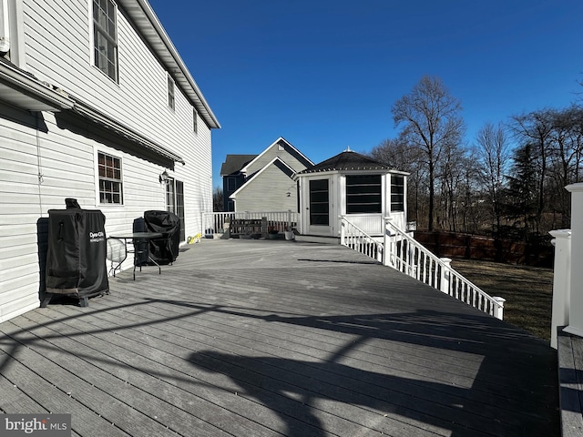 wooden deck featuring grilling area