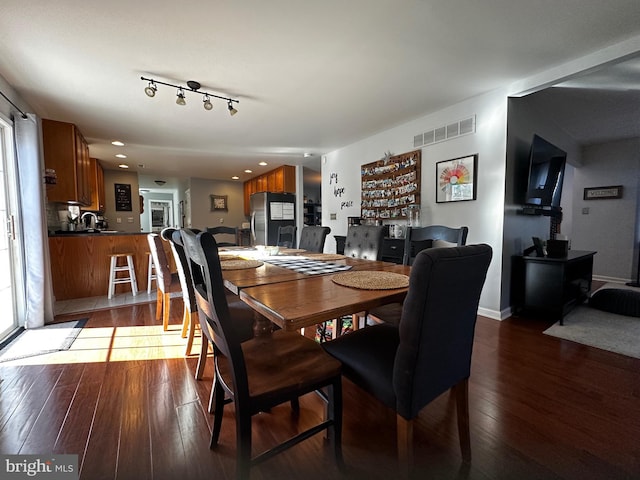 dining room featuring recessed lighting, visible vents, and wood-type flooring