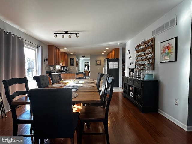 dining room featuring recessed lighting, visible vents, baseboards, and dark wood finished floors