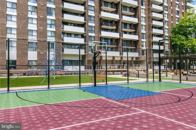 view of basketball court featuring community basketball court and fence