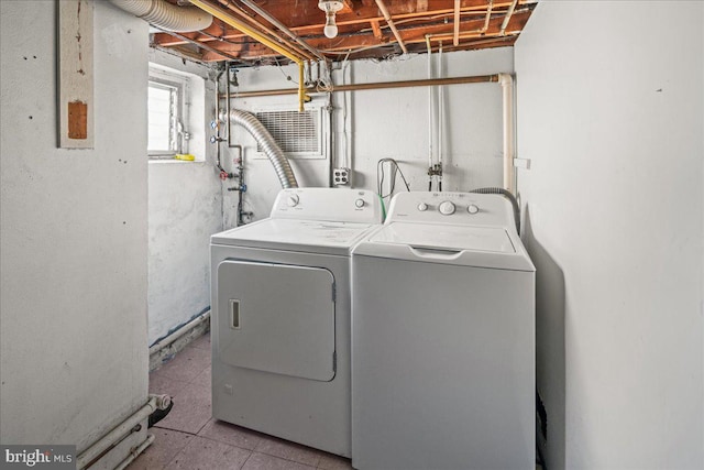 laundry room featuring laundry area and washer and clothes dryer