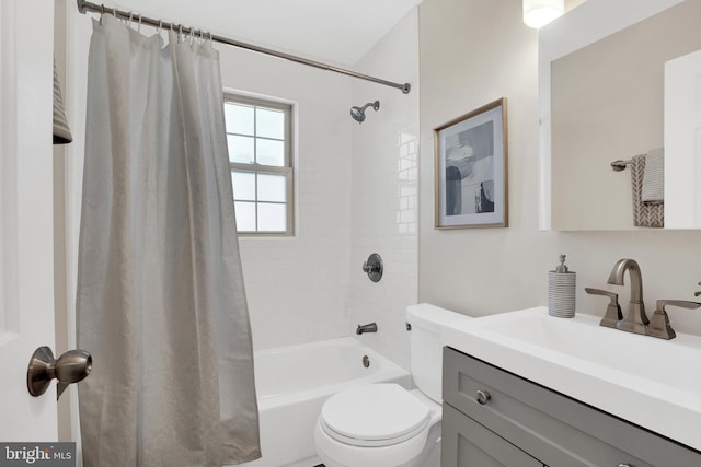 bathroom with vanity, toilet, and shower / tub combo with curtain