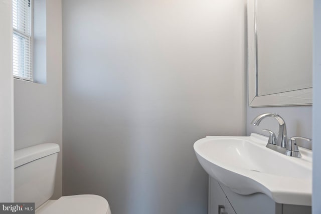 bathroom with vanity and toilet