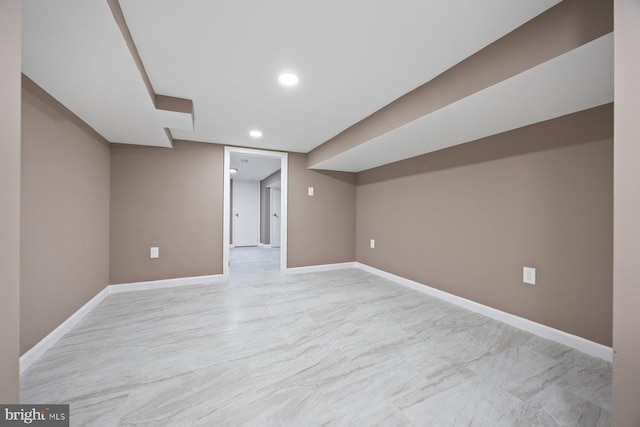 finished basement with recessed lighting and baseboards