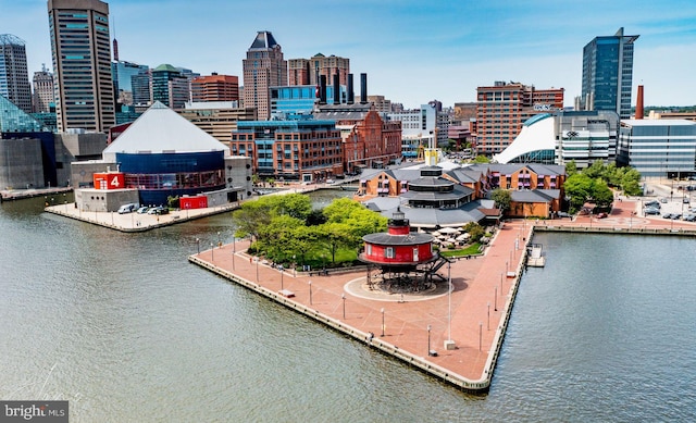 exterior space featuring a view of city and a water view