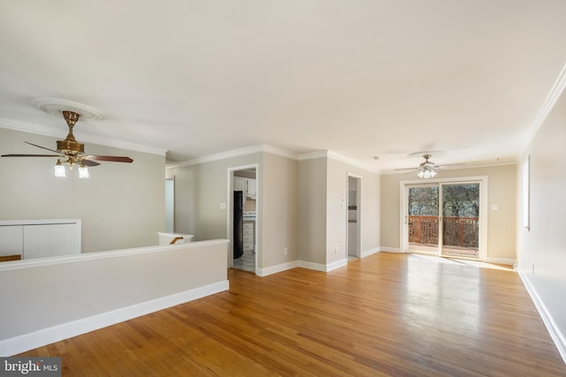 unfurnished living room with baseboards, wood finished floors, a ceiling fan, and ornamental molding