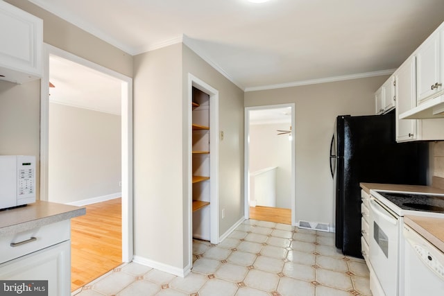 kitchen with visible vents, light floors, ornamental molding, white cabinets, and white appliances