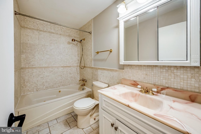 full bath with tile walls, toilet, shower / bath combination, tile patterned floors, and vanity