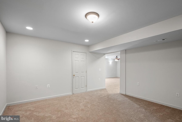 finished below grade area featuring visible vents, recessed lighting, baseboards, and carpet floors