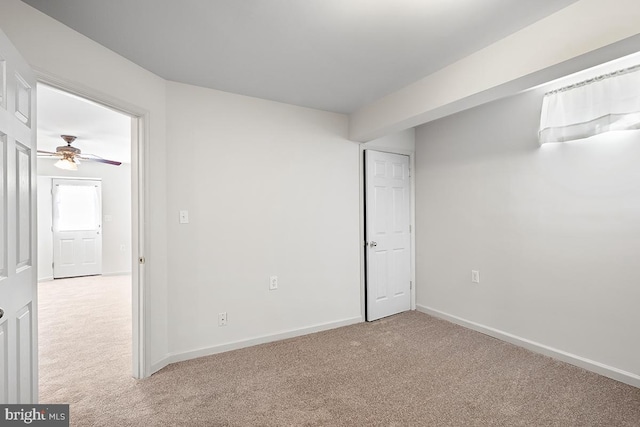 unfurnished bedroom featuring carpet flooring and baseboards