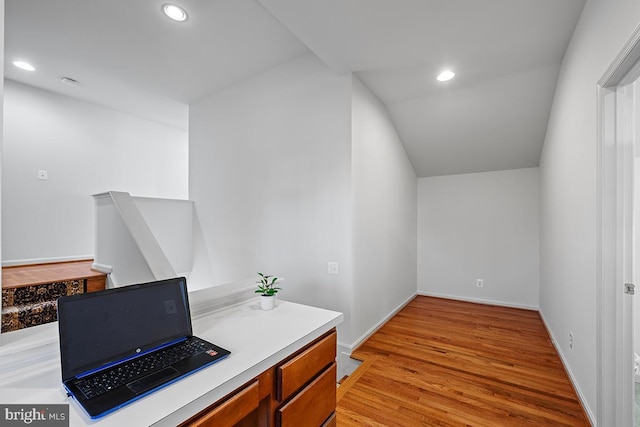 office space with recessed lighting, light wood-type flooring, and baseboards