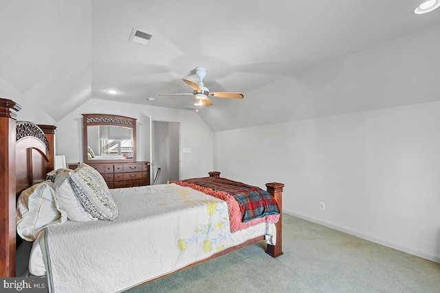 bedroom with a ceiling fan, baseboards, visible vents, carpet floors, and vaulted ceiling