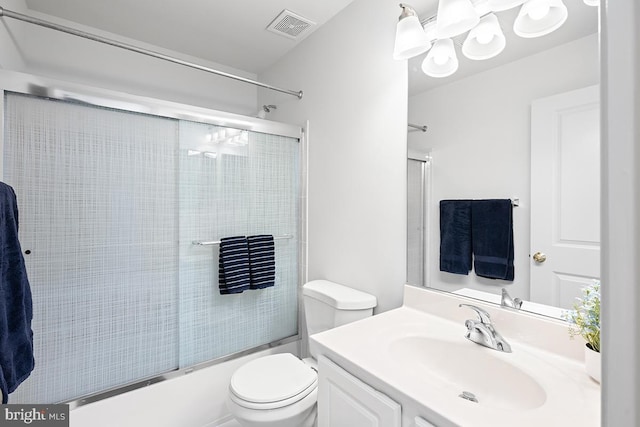 full bathroom featuring enclosed tub / shower combo, visible vents, toilet, and vanity