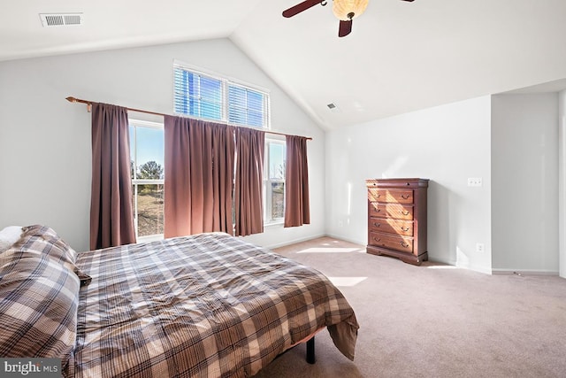 carpeted bedroom with high vaulted ceiling, baseboards, visible vents, and ceiling fan