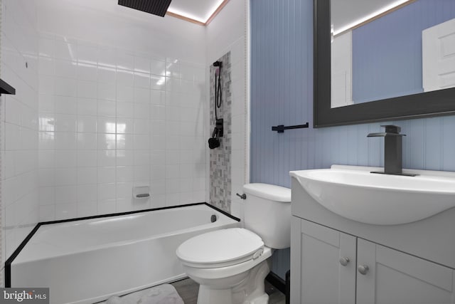 bathroom with shower / bathtub combination, toilet, and vanity