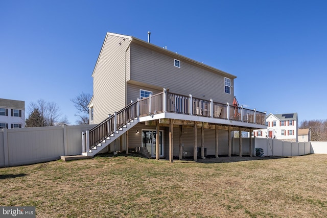 back of house featuring stairway, a lawn, fence, and a wooden deck