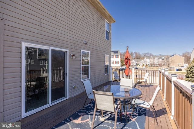 deck with outdoor dining area