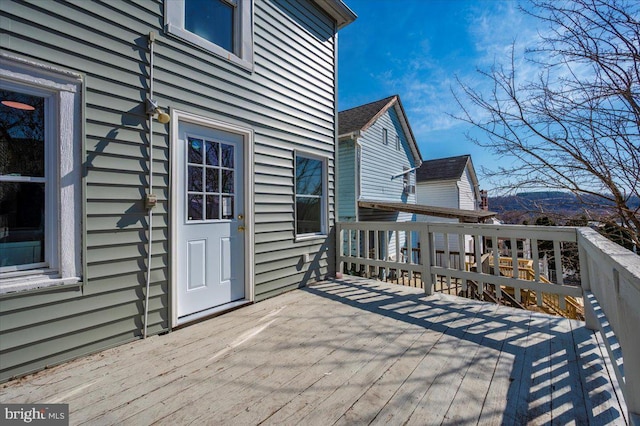 wooden terrace featuring a mountain view