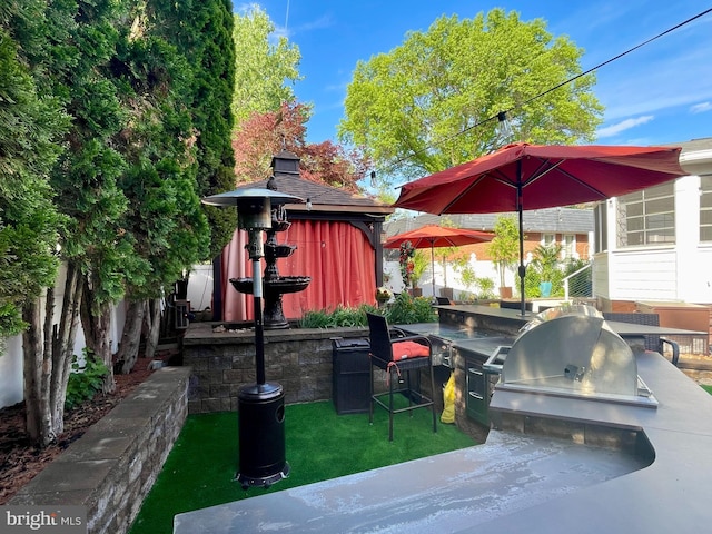 1700 Verbena St NW, Washington, DC 20012 - view of patio / terrace featuring fence, an outdoor kitchen, and a grill