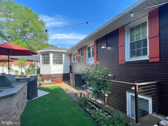 1700 Verbena St NW, Washington, DC 20012 - view of property exterior with a yard, cooling unit, and brick siding