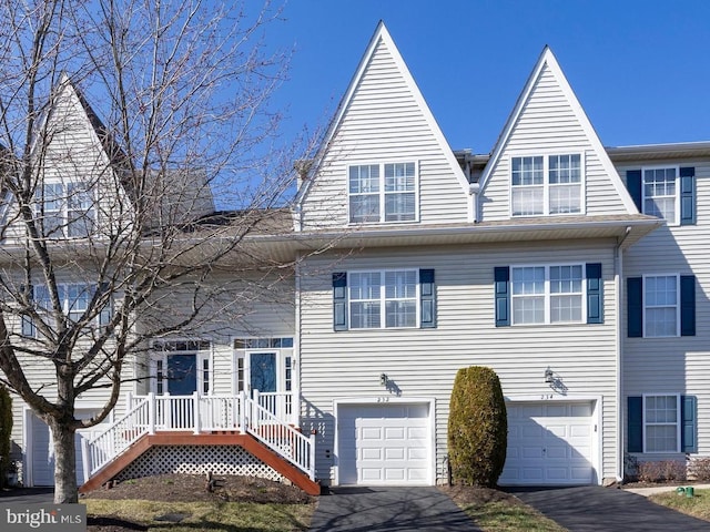 view of front of property with aphalt driveway and an attached garage