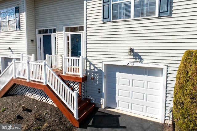 property entrance with an attached garage