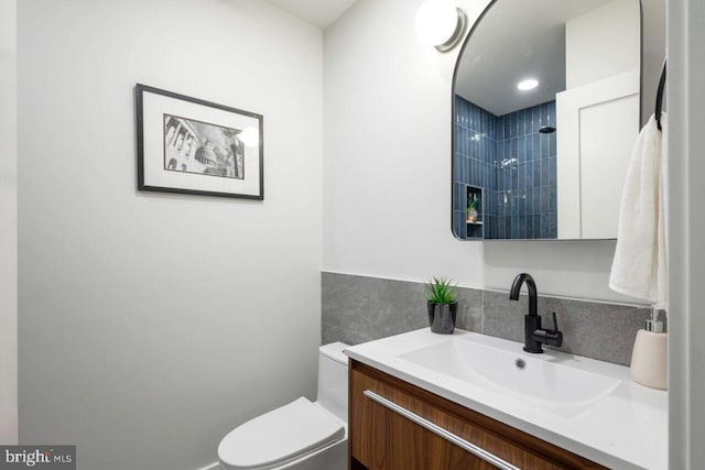 bathroom with toilet and vanity