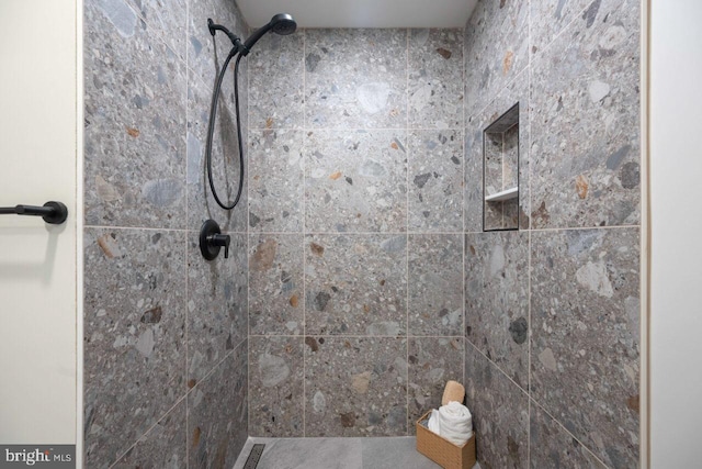 full bathroom with a tile shower