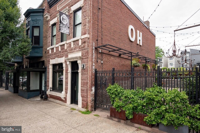 view of building exterior featuring fence