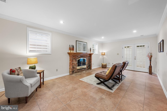 living room featuring french doors, baseboards, a brick fireplace, and ornamental molding