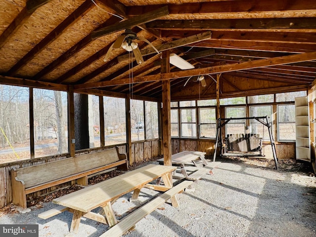 unfurnished sunroom featuring lofted ceiling and ceiling fan