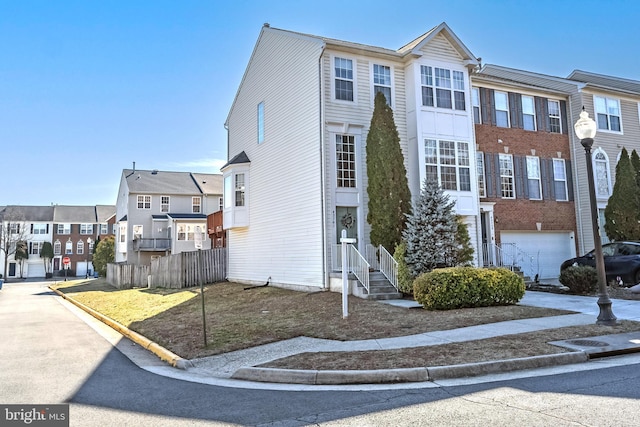 view of front of home with fence and a residential view