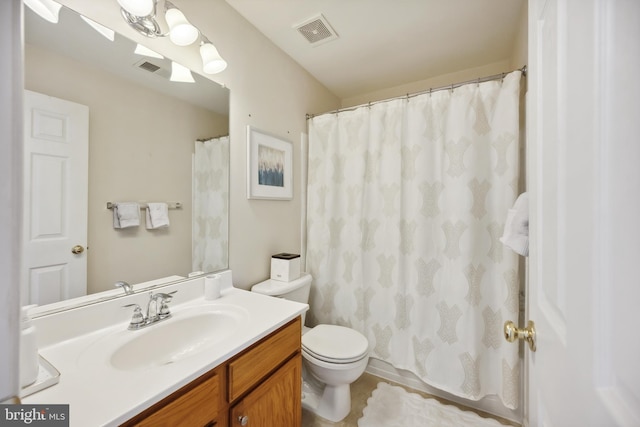 bathroom with visible vents, toilet, and vanity