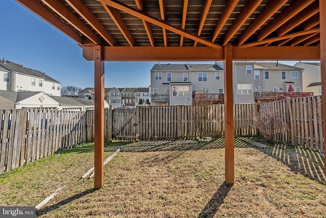 view of yard with a residential view and a fenced backyard