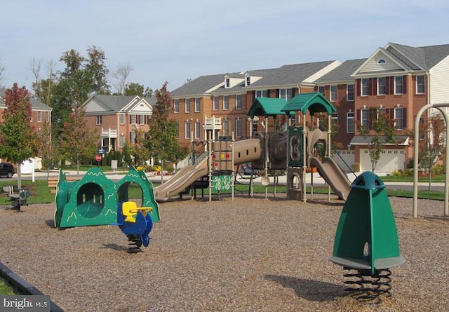 community jungle gym with a residential view