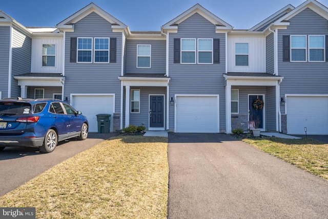 view of front of property with a garage and driveway