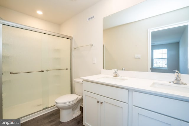 full bath featuring a sink, visible vents, toilet, and a stall shower